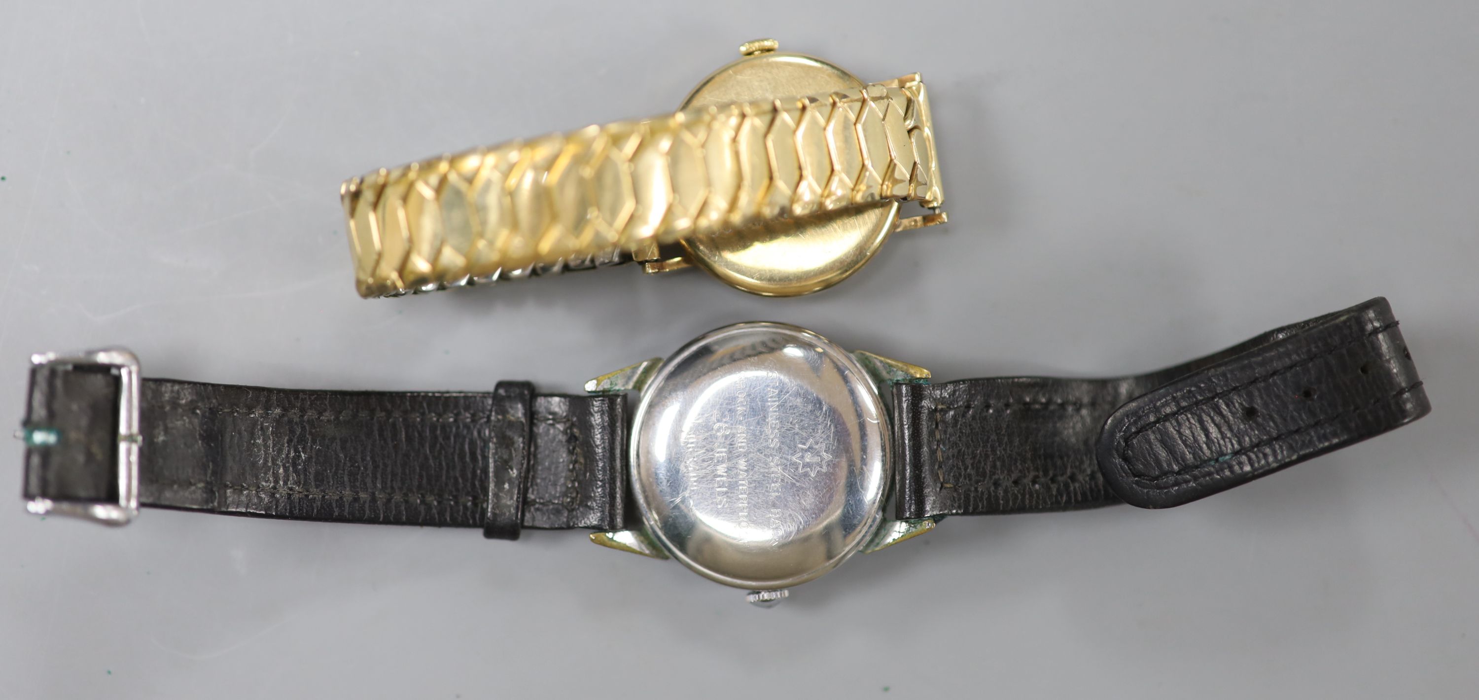 A gentlemans 9ct gold Vertex manual wind wrist watch, with case back inscription & a Junghans steel watch.